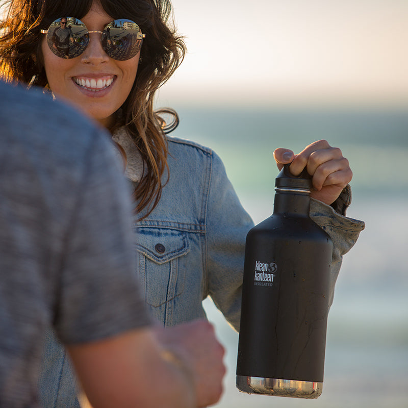 64oz-classic-with-loop-cap-u2 64oz_insulated_classic_black_beach_girl_hand_square.jpg