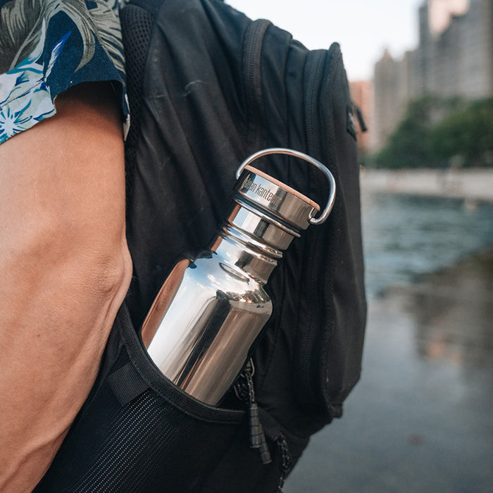27oz-reflect-with-bamboo-cap-v5 K27SSLRF-MS-BAMBOO_reflect-bottle_backpack_lifestyle.jpg